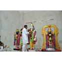 Deepakbhai placing garland of flowers on Krishna Bhagwan